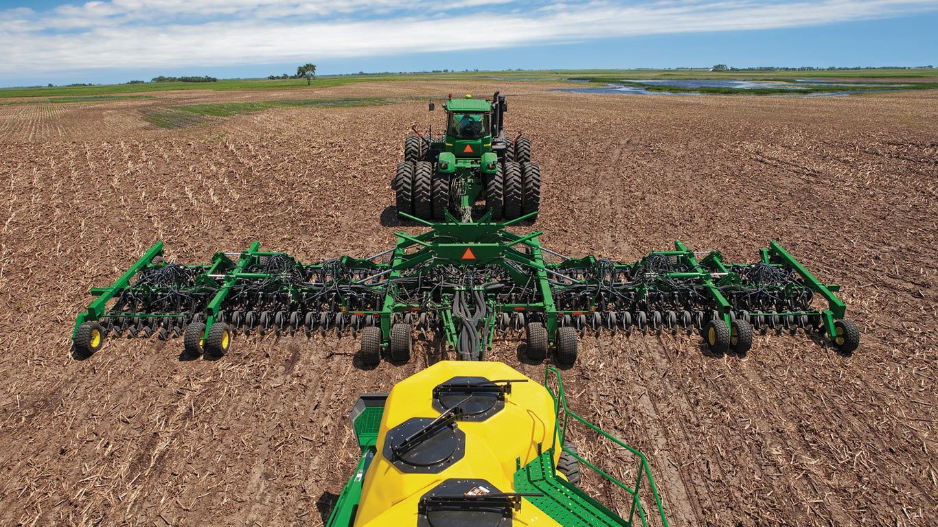 Tractor, planter and nurse tank intended to illustrate Grain Stocks, Prospective Plantings story