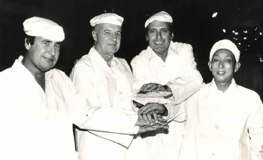 Photo shows former USW staff Fred Schneiter and Winston Wilson with a U.S. government and Chinese officials at the opening of an instant noodle pilot plant in Shanghai, China, in the 1980s.