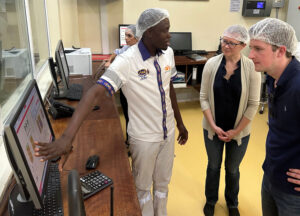 Amanda Hoey (center), Chair of the Food Aid Working Group, and USW Director of Trade Policy Peter Laudemann (right) visit a flour mill in Kenya as part of the Food Aid Learning Journey in Africa.