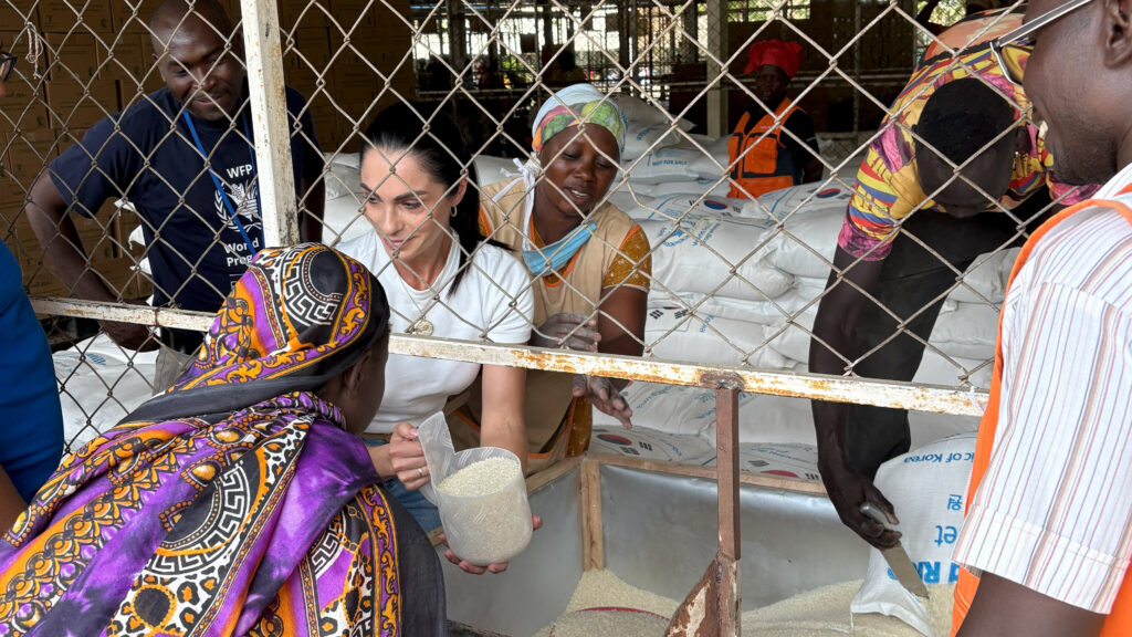 Domenique Opperman,Program and Marketing Specialist in USW's Cape Town Office, learns about the food distribution process at the Kakuma Refugee Camp in Kenya.