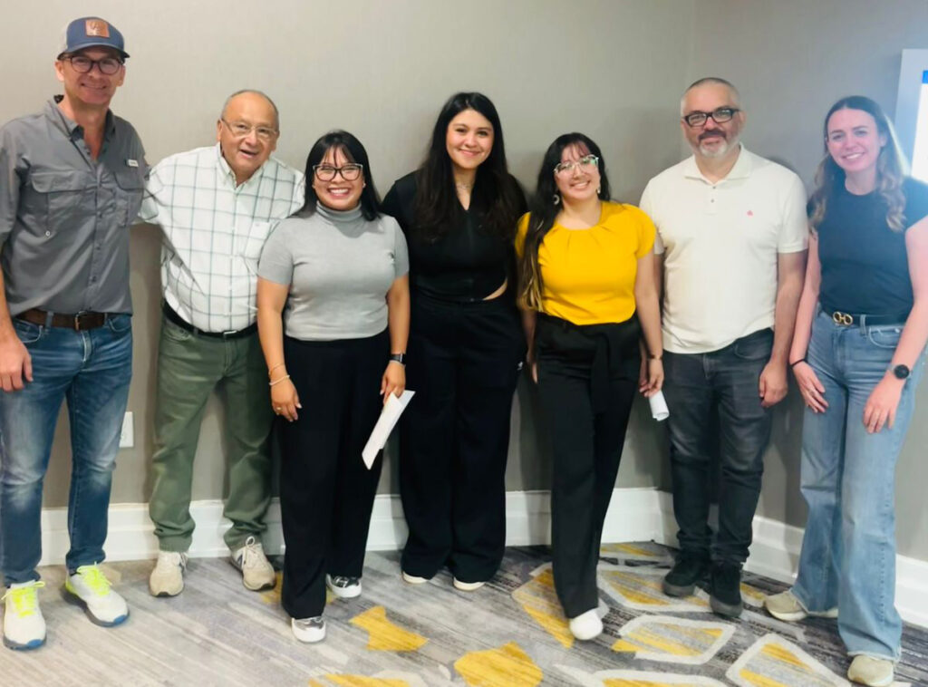 USW's Pamela Rubio (third from left) and Tyllor Ledford (far right) pose with the team sponsored by USW's Mexico City Office.