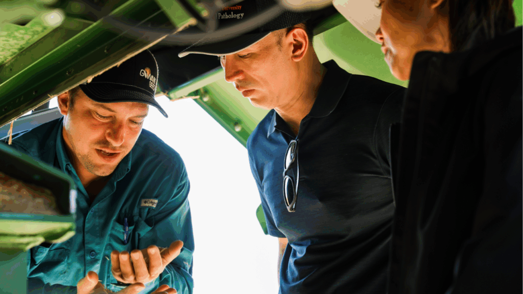 Examining farm equipment in an Oregon wheat field.