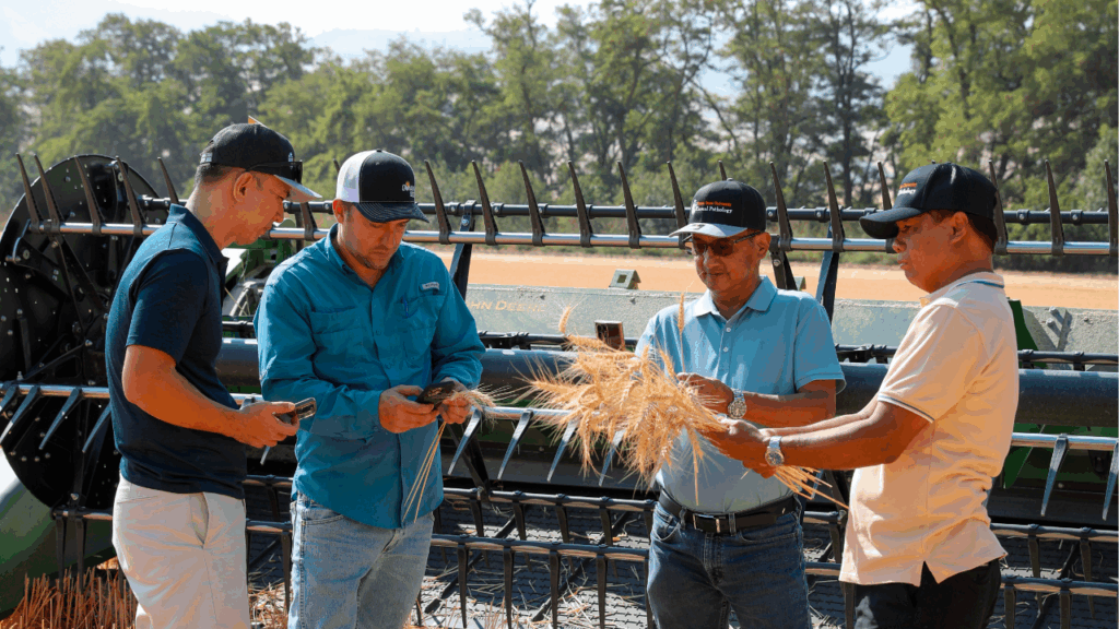 Trade team examines wheat in an Oregon field