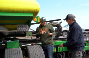 Mark Jossund, right, and his son Carson prepare to plant corn near Hendrum, Minnesota. As his two sons gradually handle more responsibilities on the family farm, Jossund is able to spend more time serving USW and other agricultural organizations.