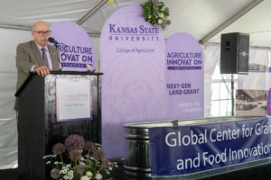 Ernie Minton, the Eldon Gideon Dean of K-State's College of Agriculture, provides remarks during the groundbreaking ceremony for the Global Center for Grain and Food Innovation, May 17 in Manhattan, Kansas.