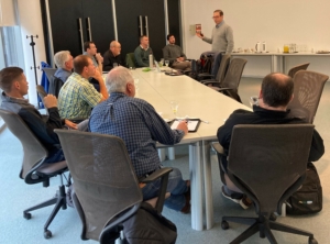 Image shows U.S. farmers at a conference at Bioceres headquarters in Argentina to demonstrate careful engagement.